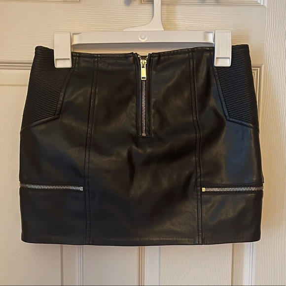 vintage leather skirt with accent zippers on front and back for a flirty touch - Picture 2 of 2